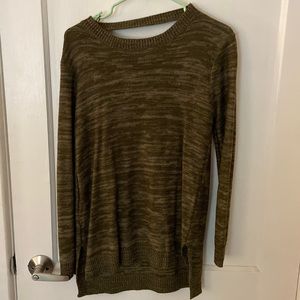 Green sweater with cross cross cut out on back